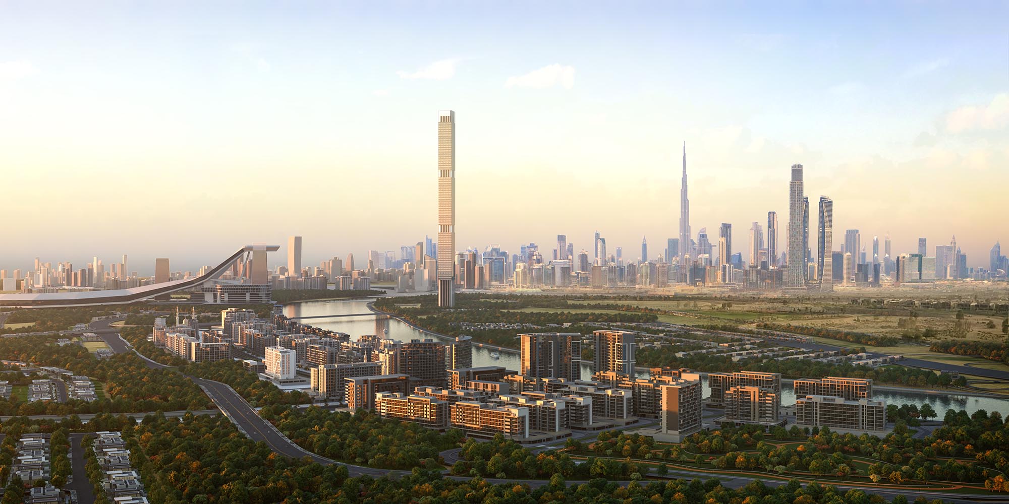 Panoramic aerial view of Azizi Riviera community in MBR City with Dubai skyline at golden hour